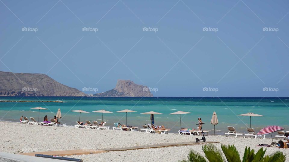 Beach#parasols#sunbeds#stones#sea