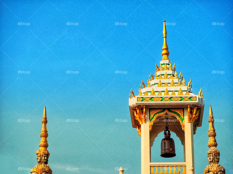 A hanging bell inside a Buddhist temple.