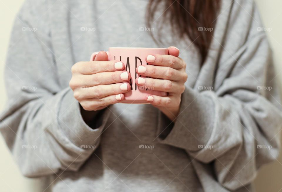 person holding a cup