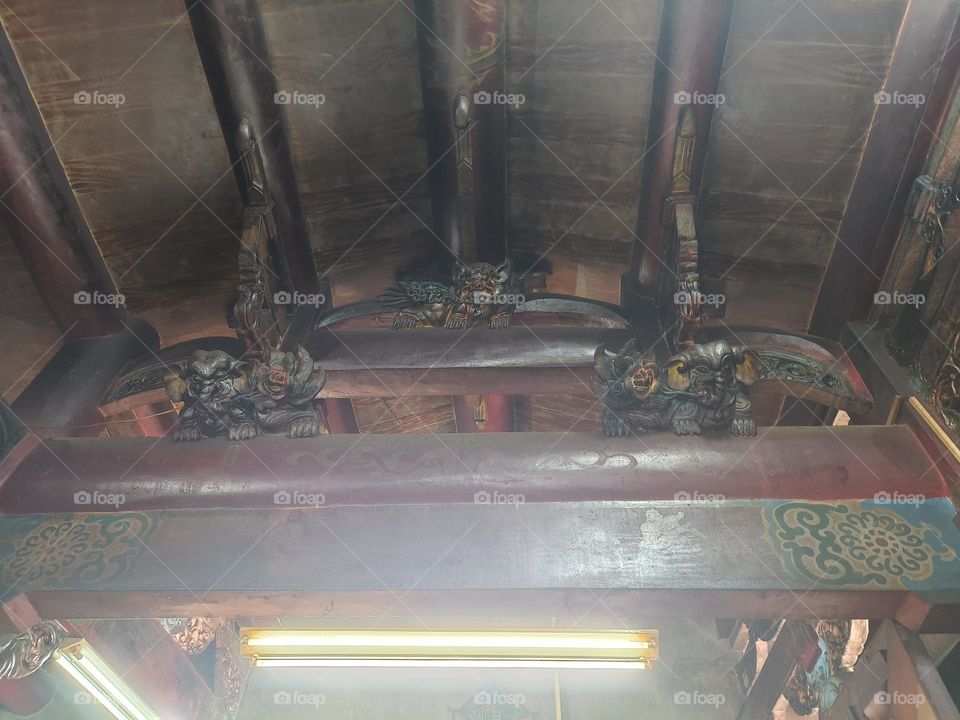 Statues on beams in temples in Taiwan