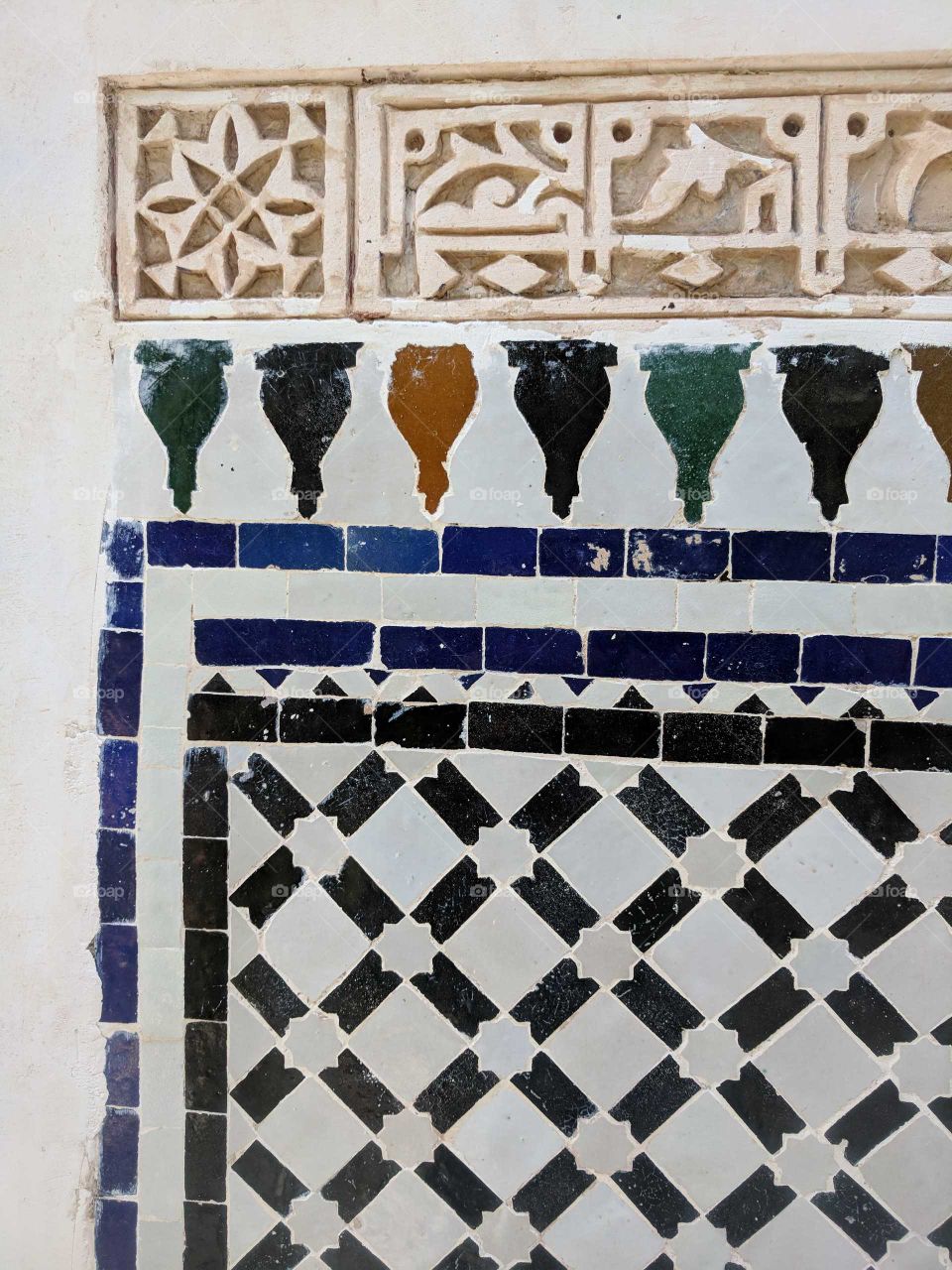 Close Up of Colorful Ceramic Tile Mosaic Wall/Floor Details in the Bahia Palace in Marrakech in Morocco