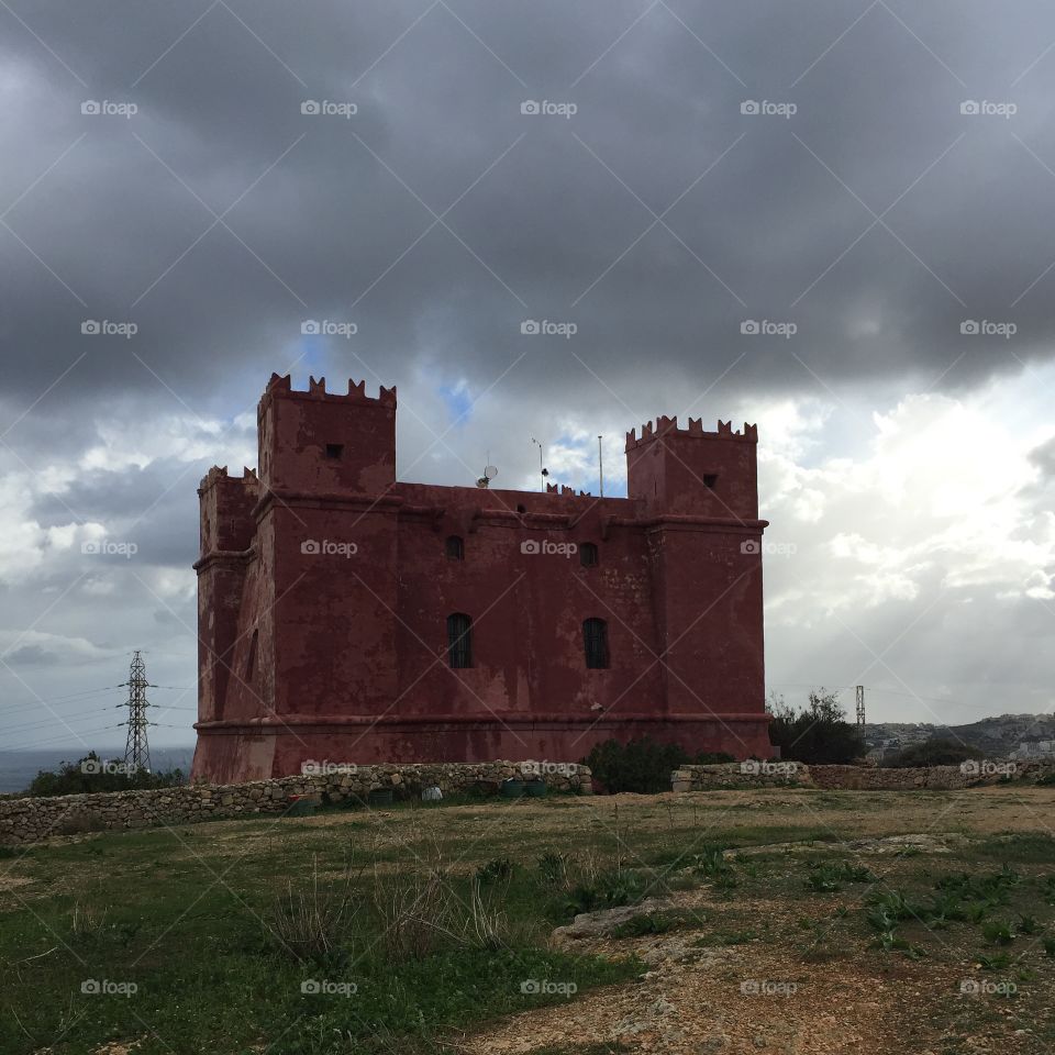 Malta red tower castle built by the Knights of Malta for military defense 