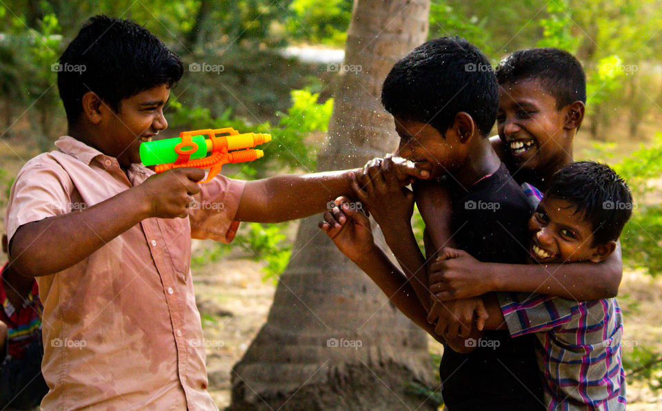 A Splash story of a village boys playing with water gun