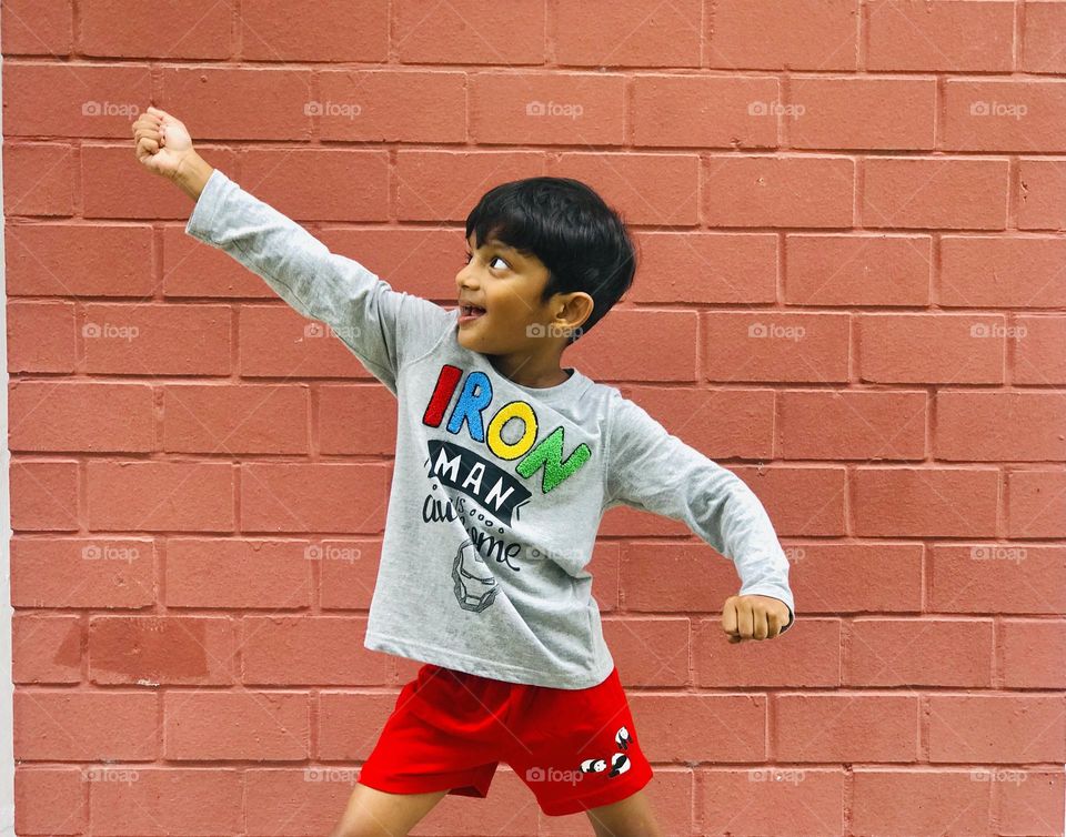 The boy making fun at outdoors.