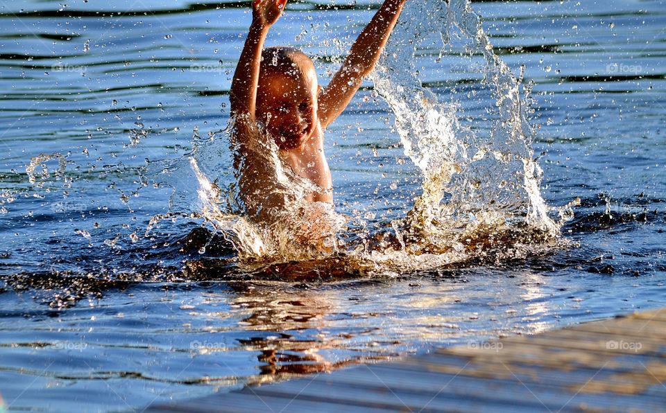 Playing child while bathing