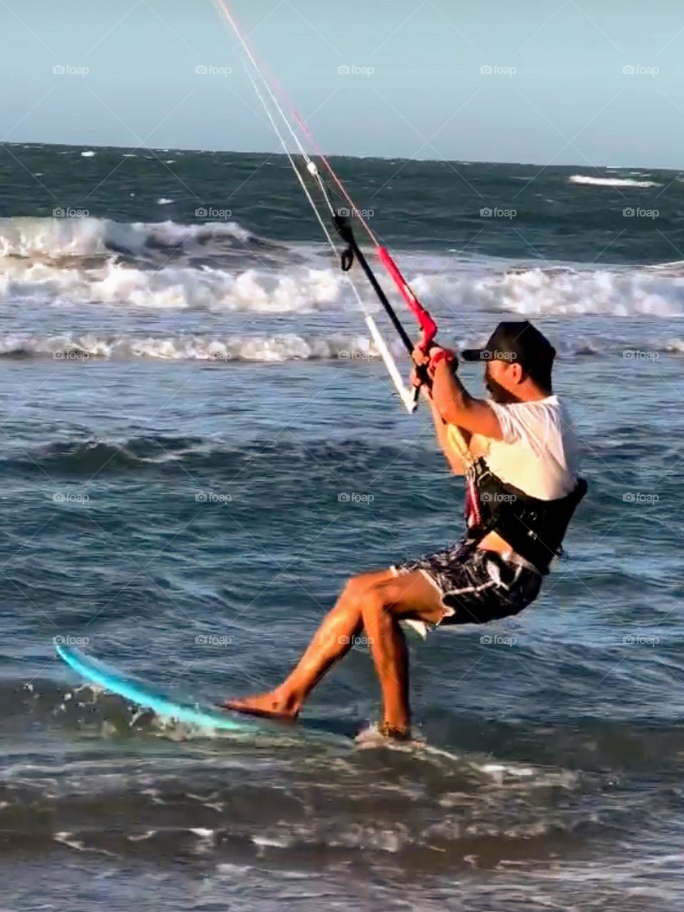 Man practicing kitesurfing