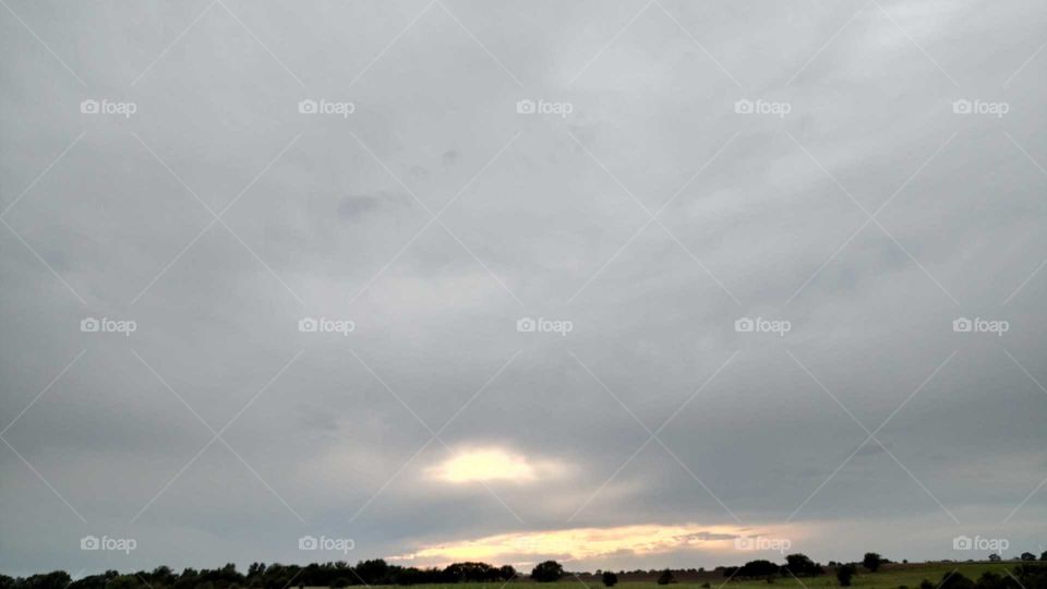 Cloudy Skies with Sunset Breaking Through