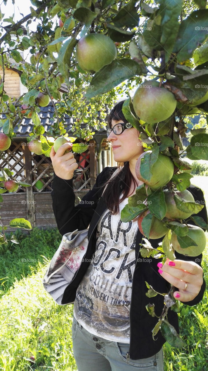 a girl and an apple tree