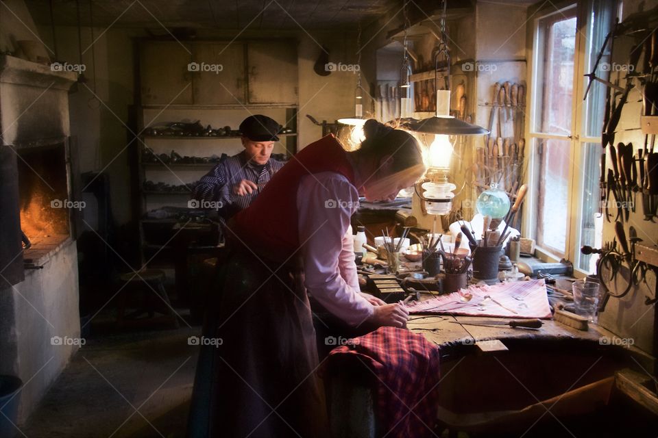 Couple working in workshop