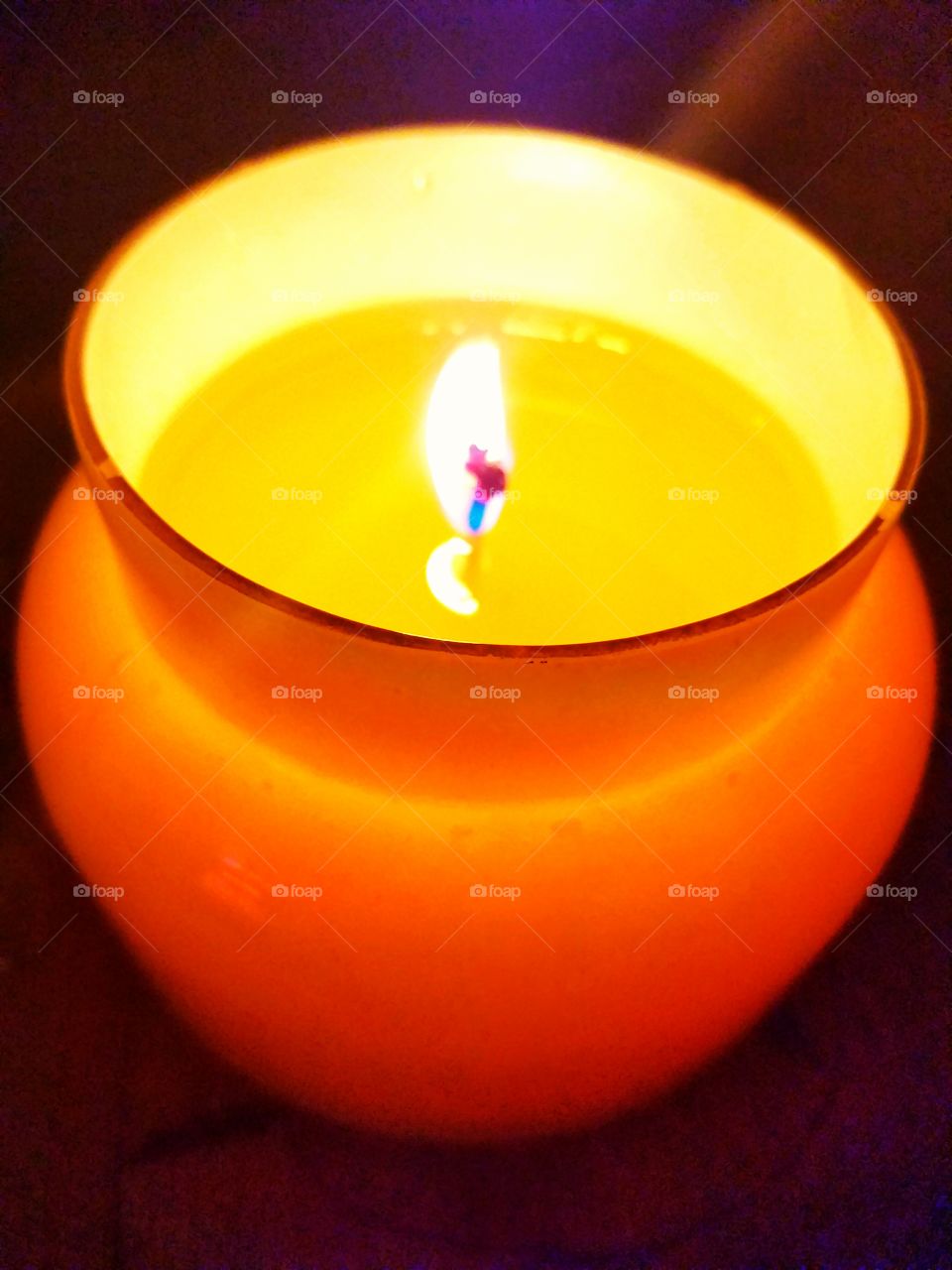 glowing candel burning in the night