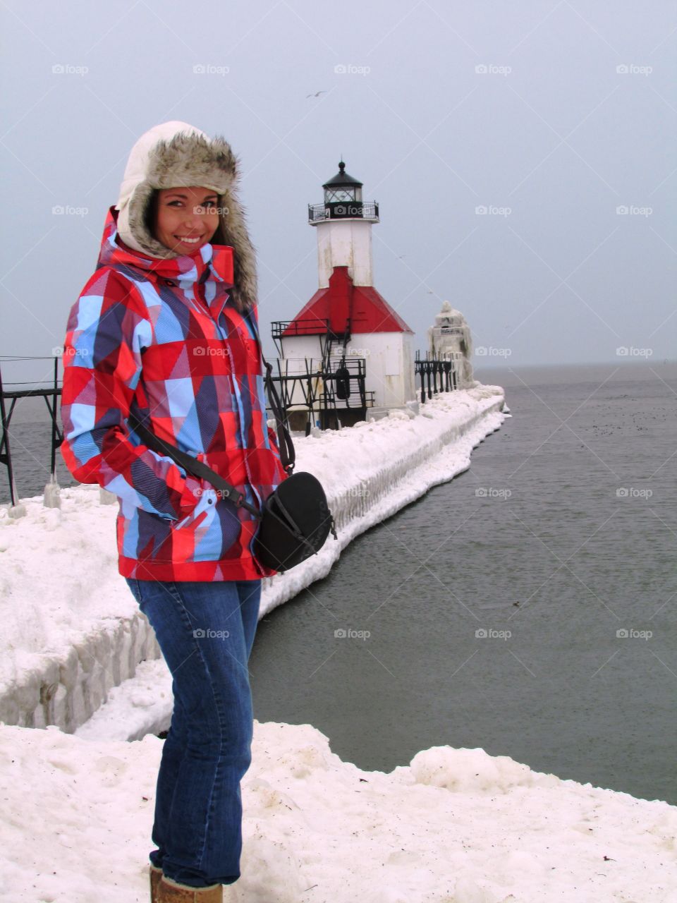 Woman standing on the pier during winter