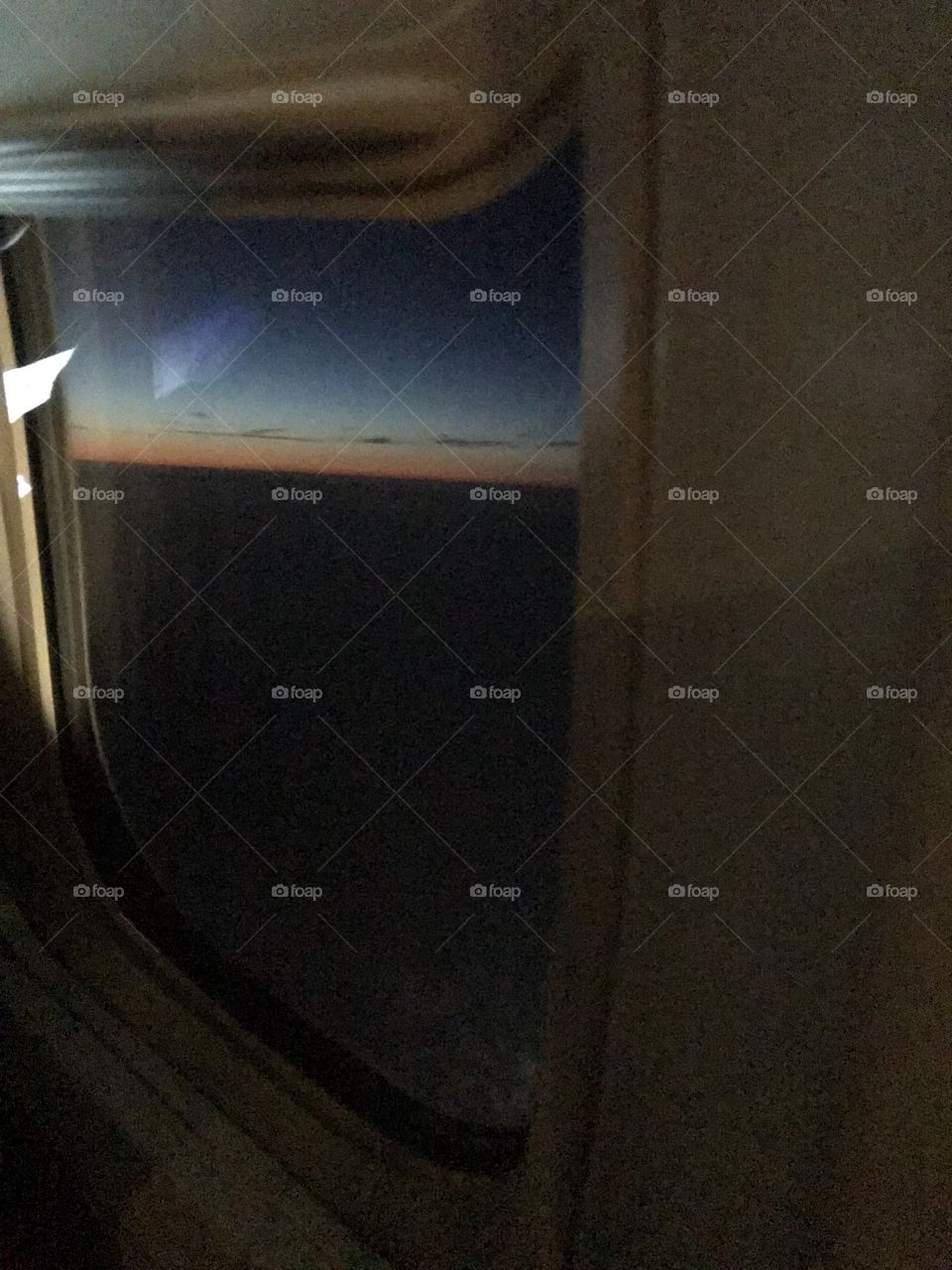 Chasing the sun - airline window photo 