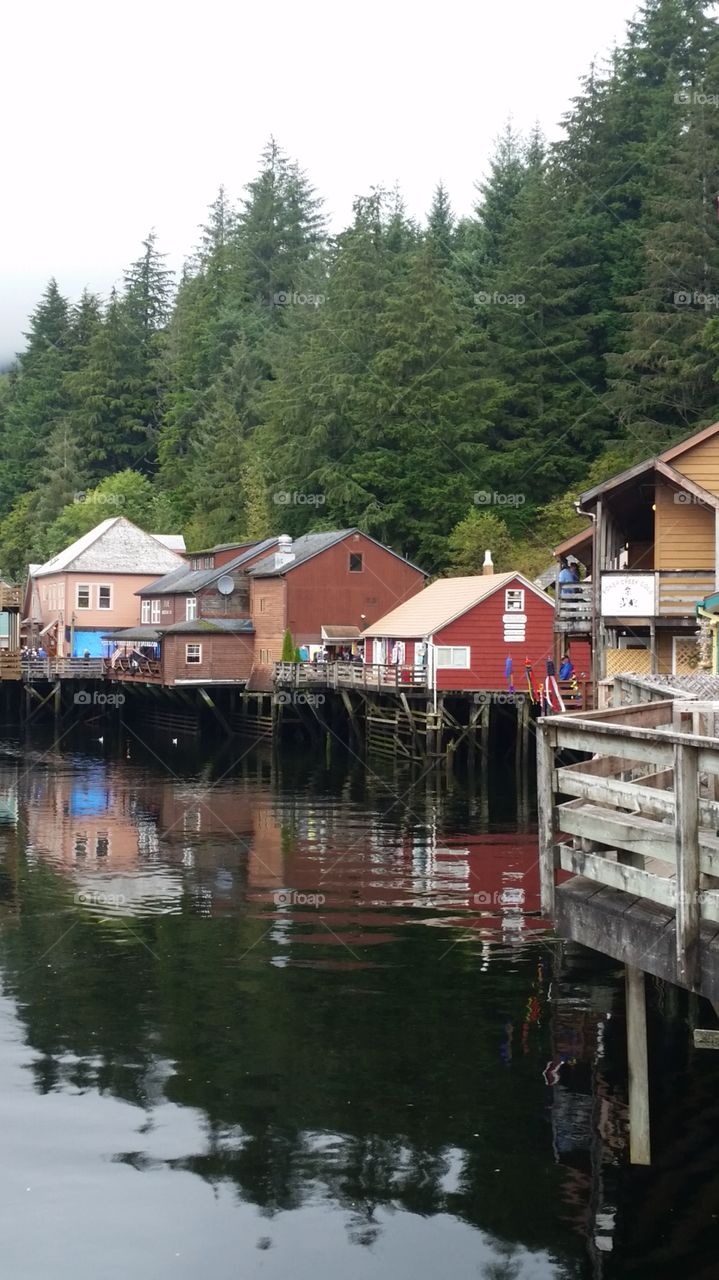 View of fisherman's wharf village in Ketchikan Alaska, with houses risen over the water