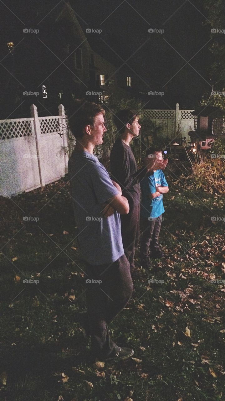 Group of people standing at backyard