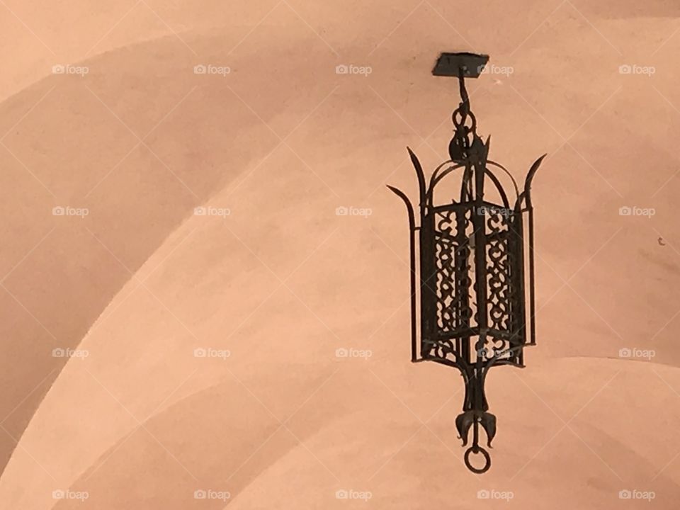 Spanish architecture lamp hanging in antique building