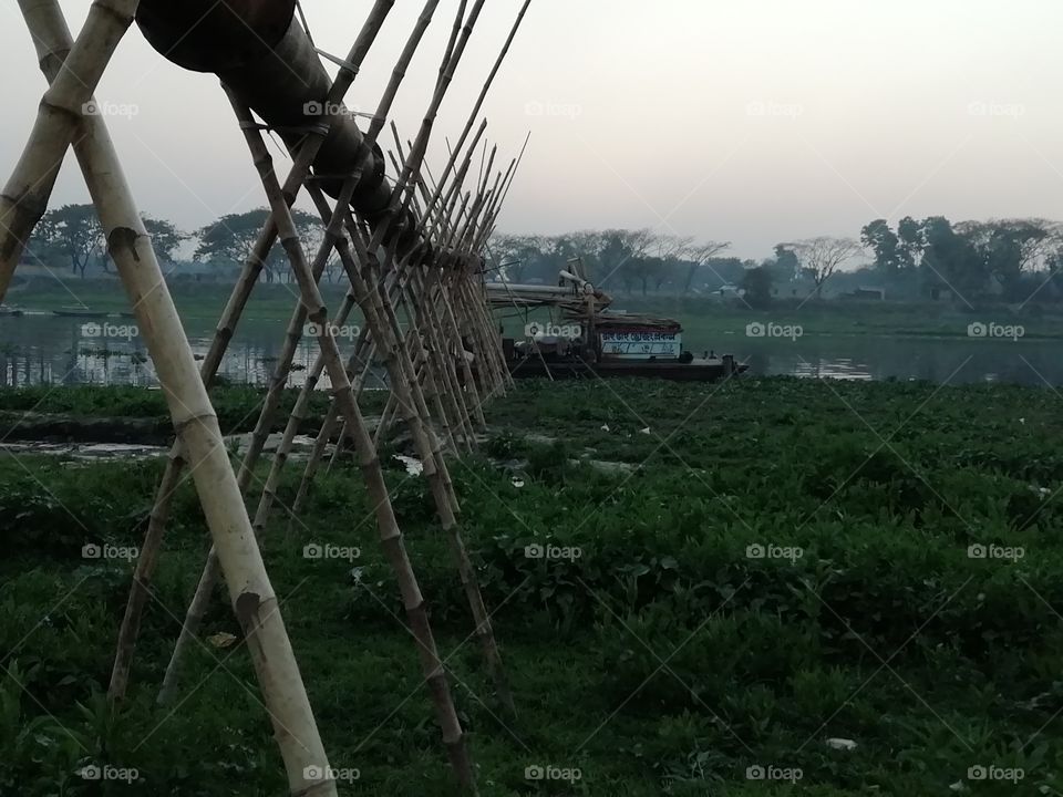 dredger with bamboo