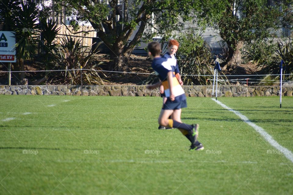 Happiness of playing football with friend 