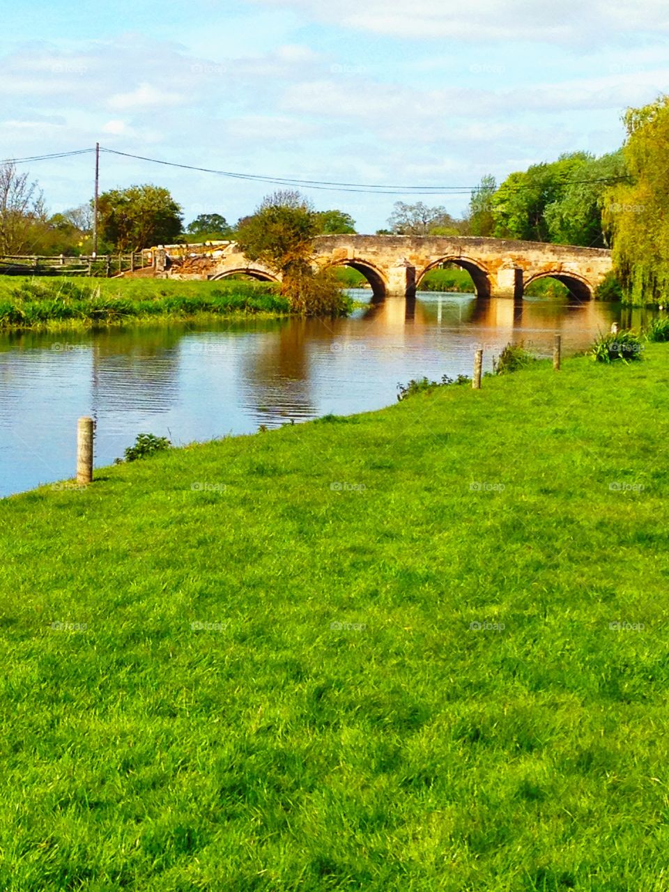River and stone bridge. River and old stone bridge in the English countryside