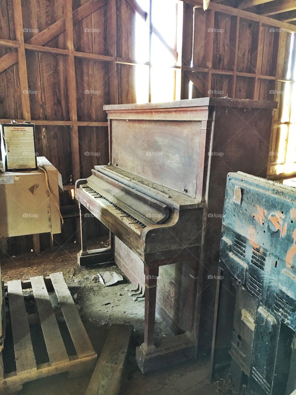 Vintage piano stored in a turn of the century barn. 