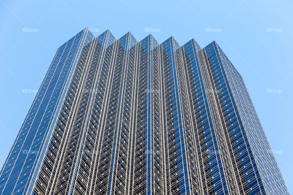 Reflection or illusion? Glassy building, looking up