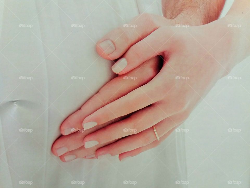 Man and pregnant woman with hands on belly