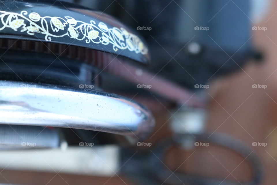 Close up details of an old sewing machine.