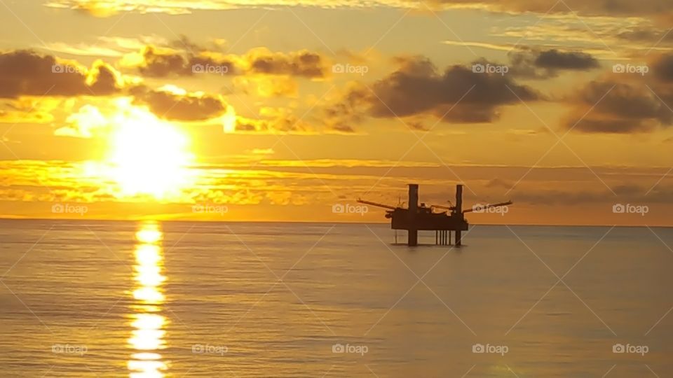 Offshore oil rig sunrise