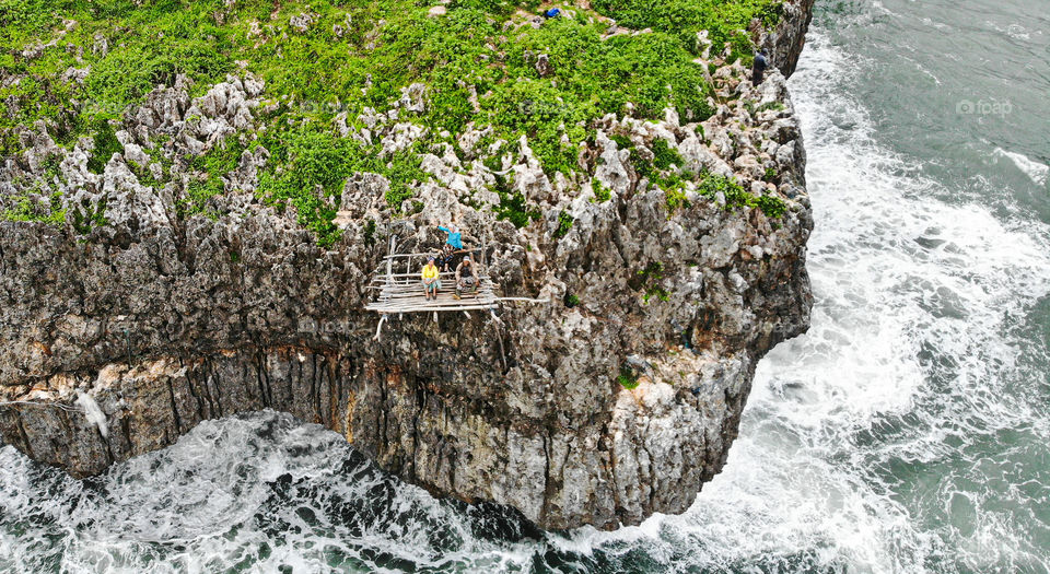 Fishing on the cliff in Yogjakarta Indonesia. It can be done simple ways but we prefer the adventure way.