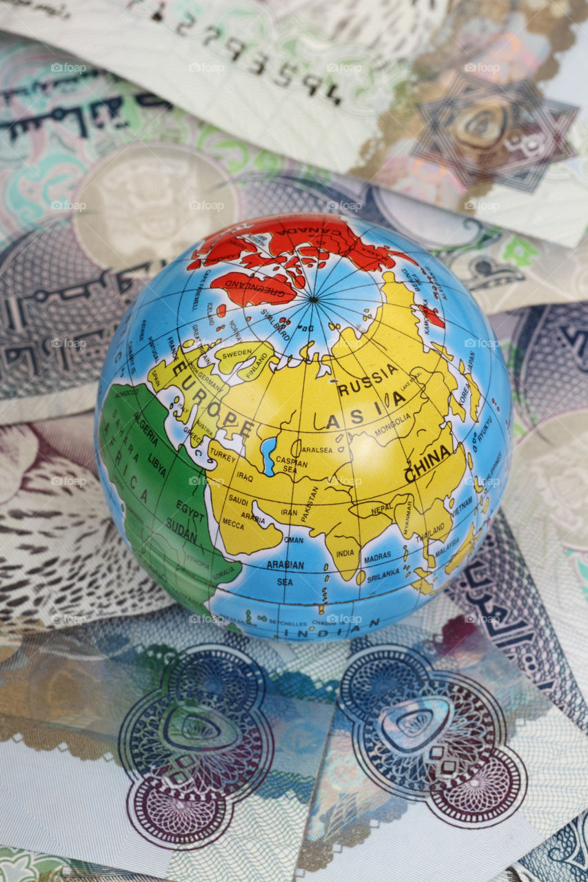 Globe on UAE dirham money currency