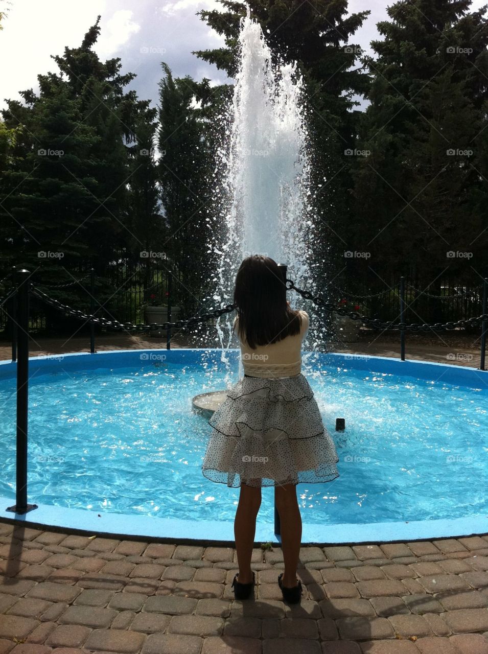 Girl and water fountain 