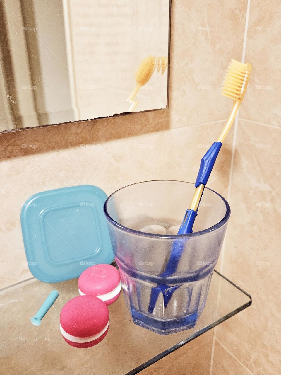 Bathroom mirror, contact lens case, toothbrush, mouthwash cup