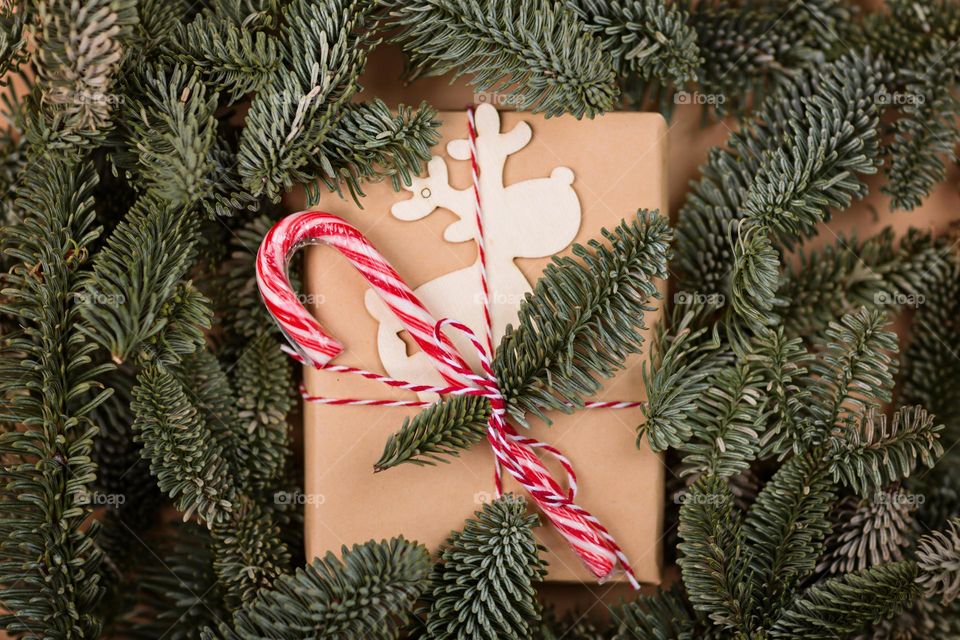 Wrapped Christmas gifts and fir branches 