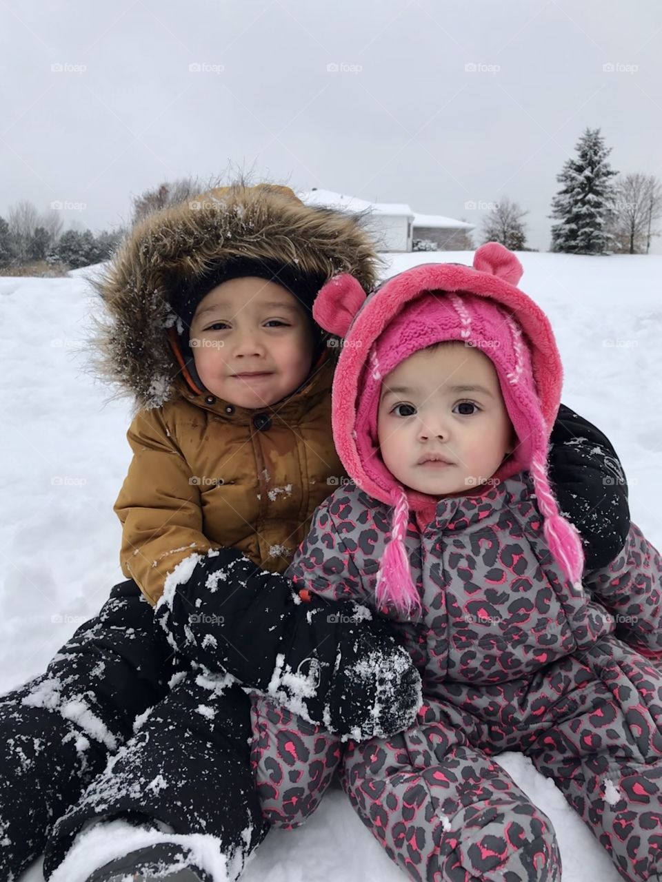 Brother and sister in the snow