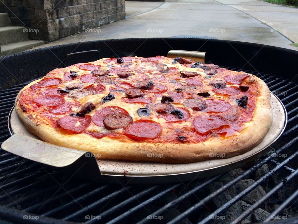 Grilled pizza on a stone. 