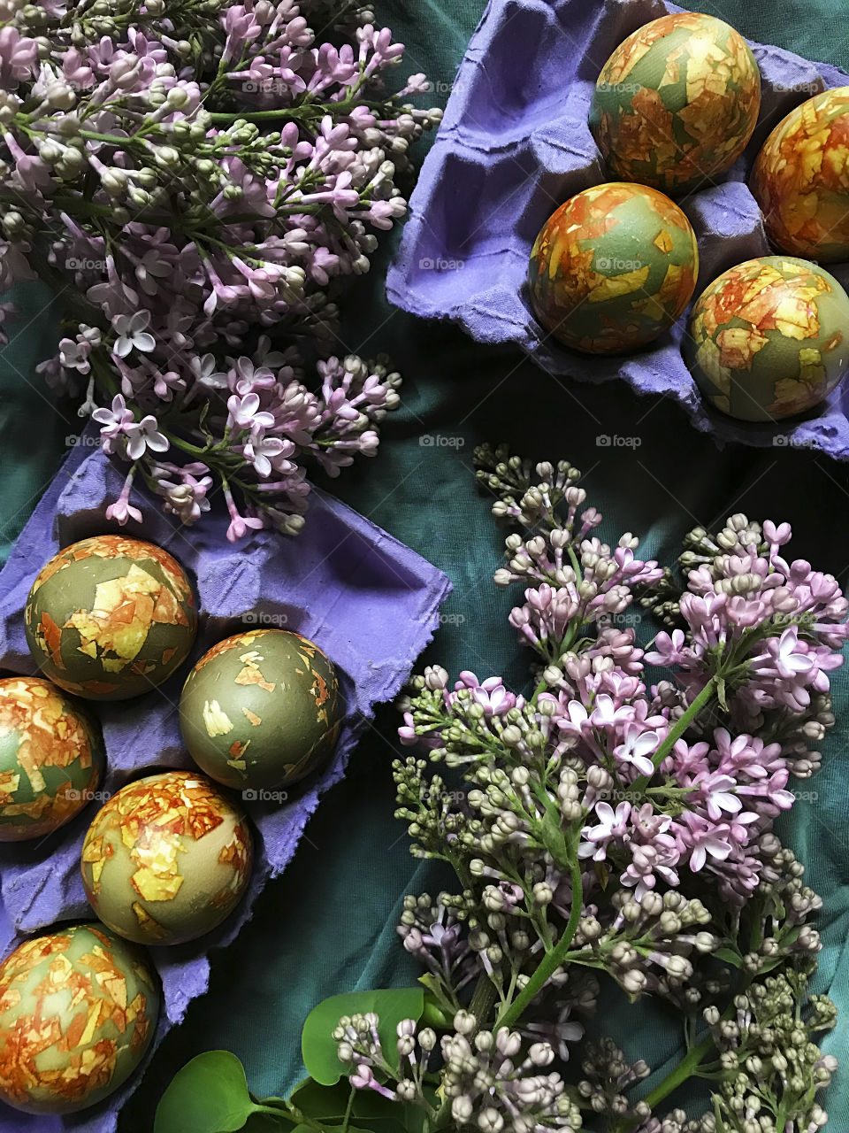 Marble Easter eggs and lilac flowers 