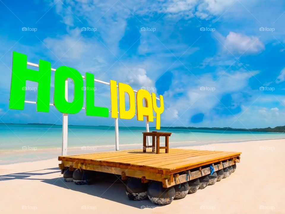 Spot photos with a holliday background at Ngurbloat Beach - Kei Island