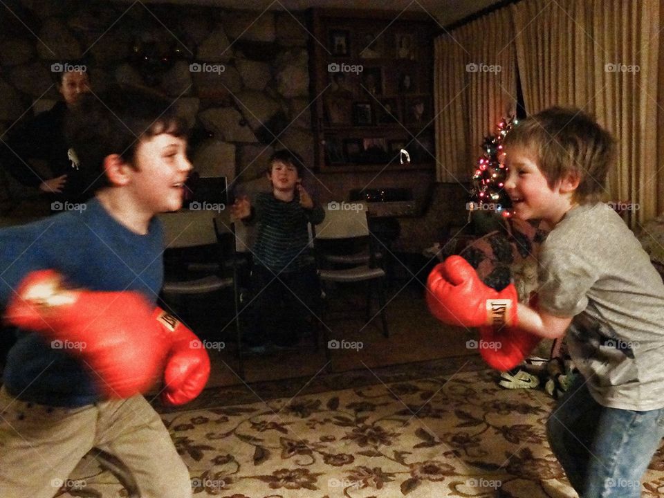 Young Boxers. Boys Fighting A Friendly Bout With Boxing Gloves
