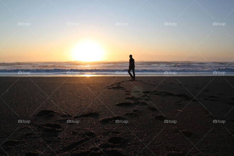 beach black footprints dusk by ronwald