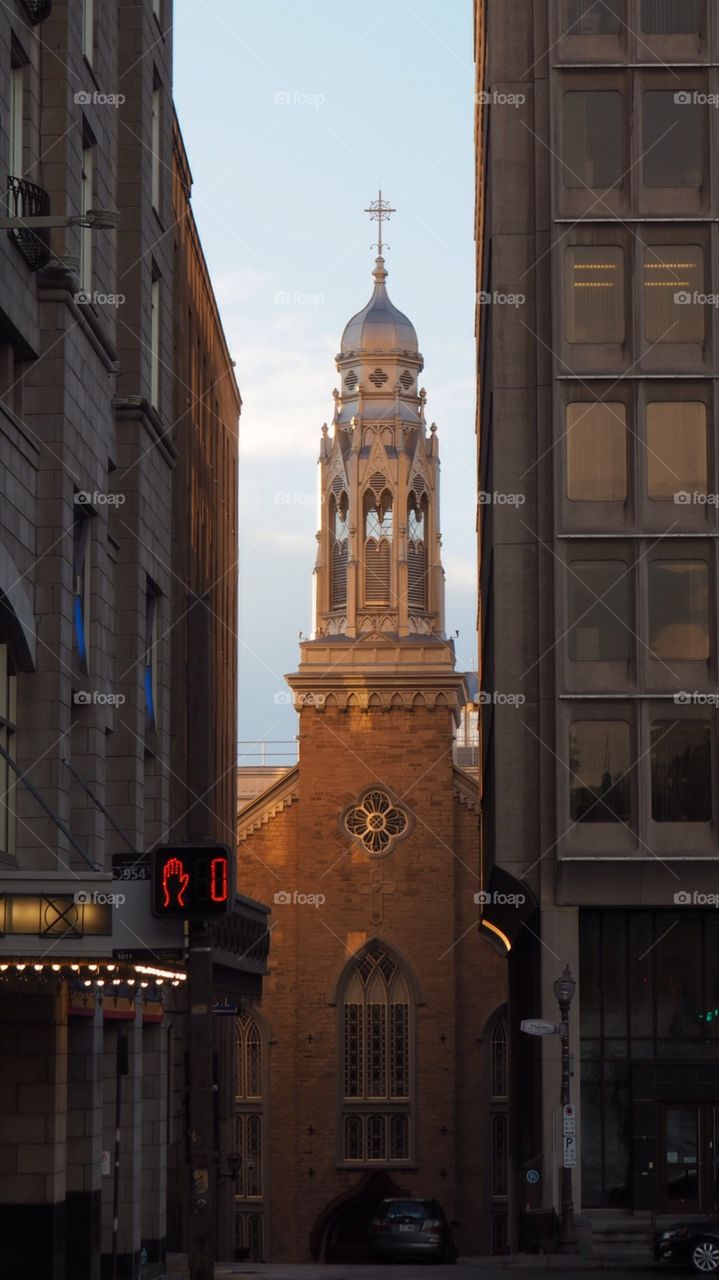 Do not walk, church bell tower at sunset