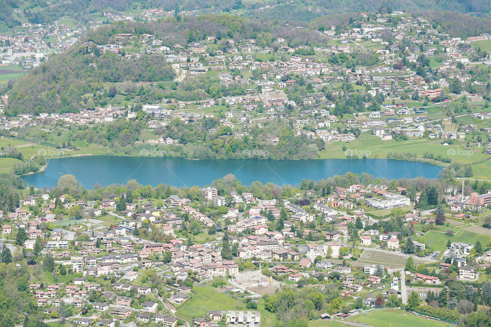 view from monte generoso down to lugano and its lake in switzerland .