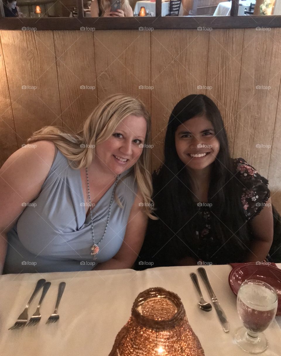 Mother and daughter sharing a special dinner together.