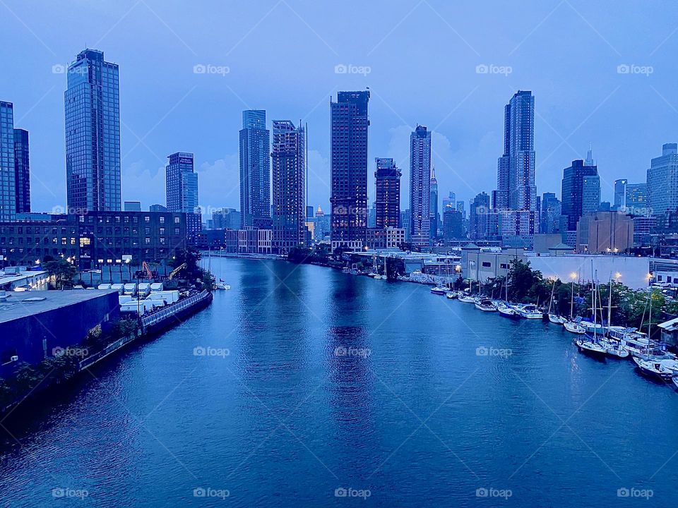 This is “Newtown Creek” seen from the “Pulaski Bridge” in LIC, Queens on an Indian summer evening in September 2023. “Greenpoint”, Brooklyn can be seen on the left, LIC and “Manhattan” on the right. Hypnotic Productions