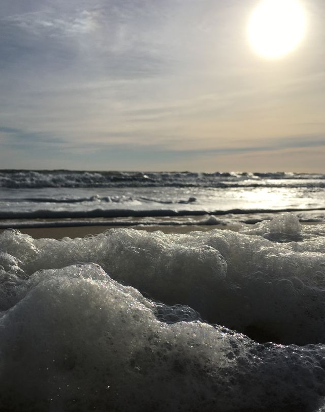 Foamy ocean at sunrise 
