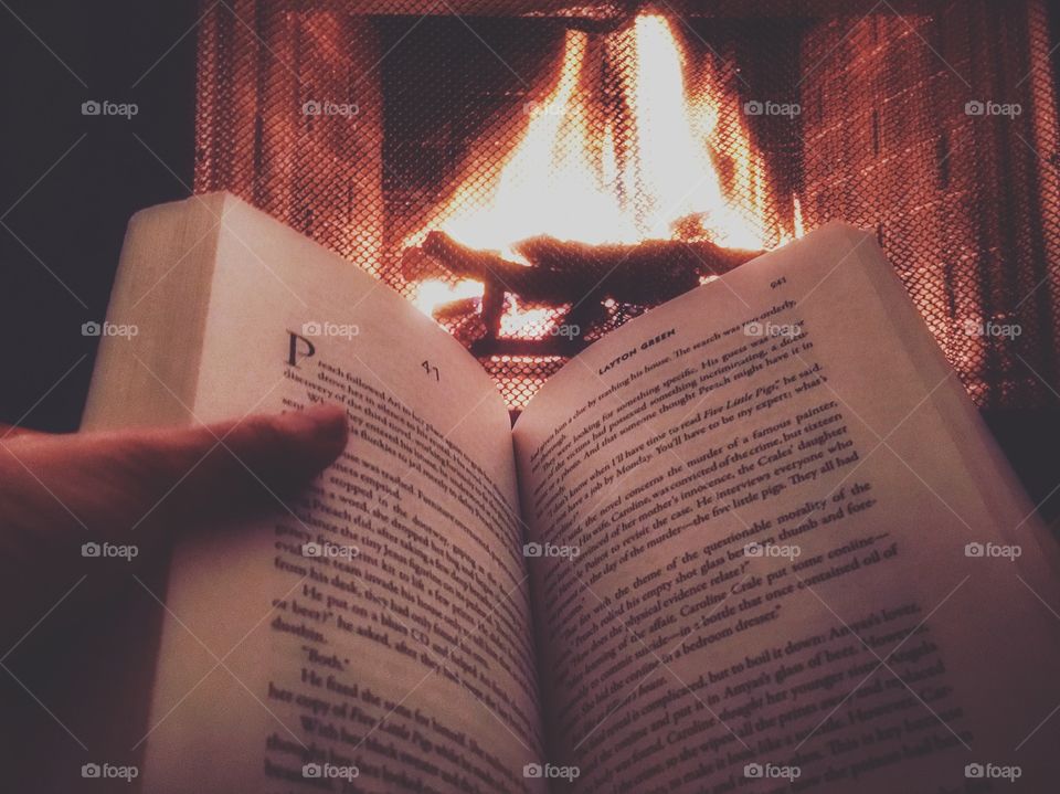 Getting cozy with a book by the fire 