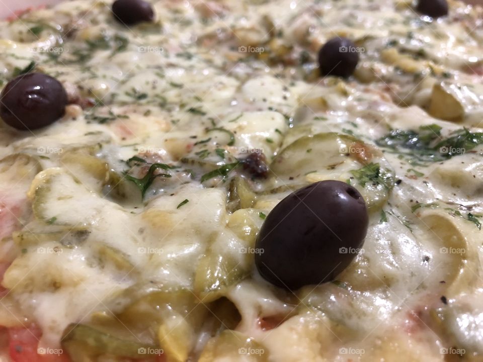 Pizza!!! Yes! Zucchini and Cheese, and some Olives... Delicious! A good meal any time. Tasty!!