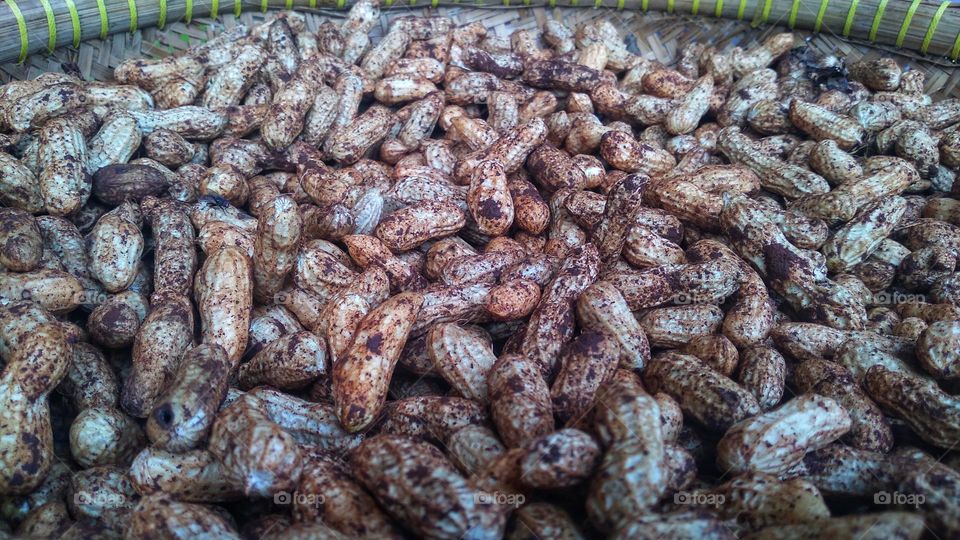 Peanuts being dried in the sun for cooking purposes
