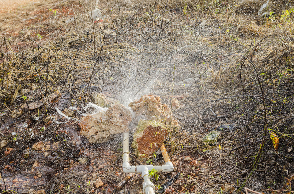 Water Spraying From Leaking Plastic Pipe