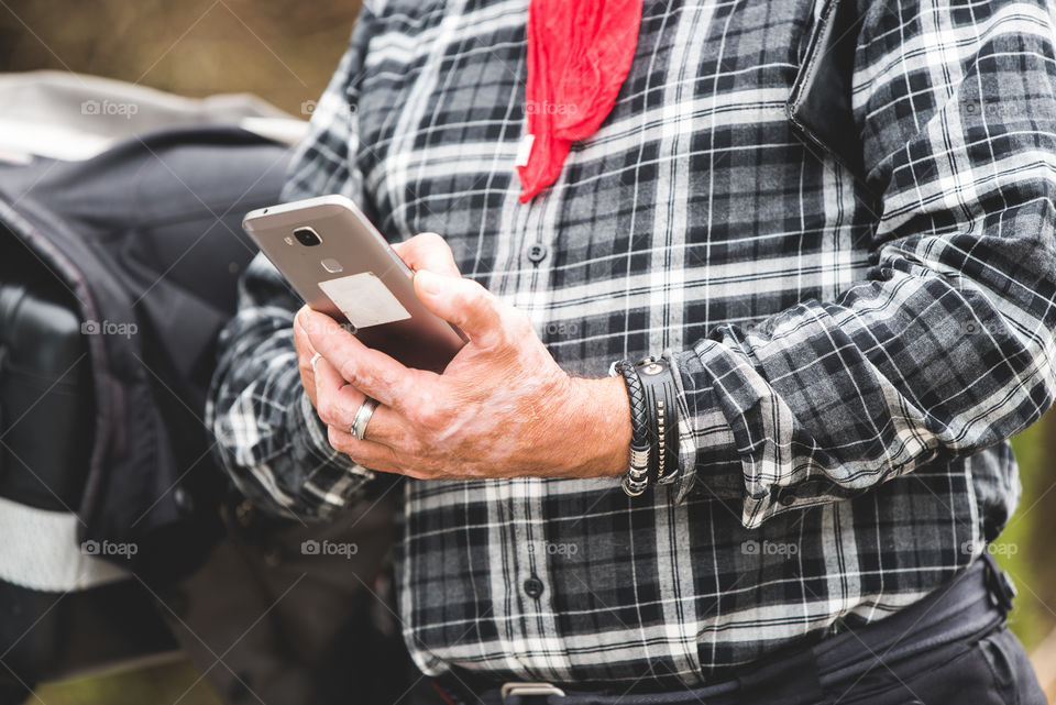 older man using his phone