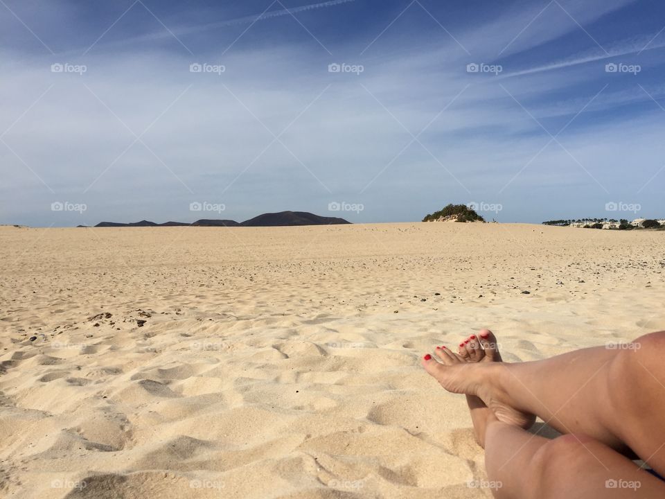 Legs and feet on a beach