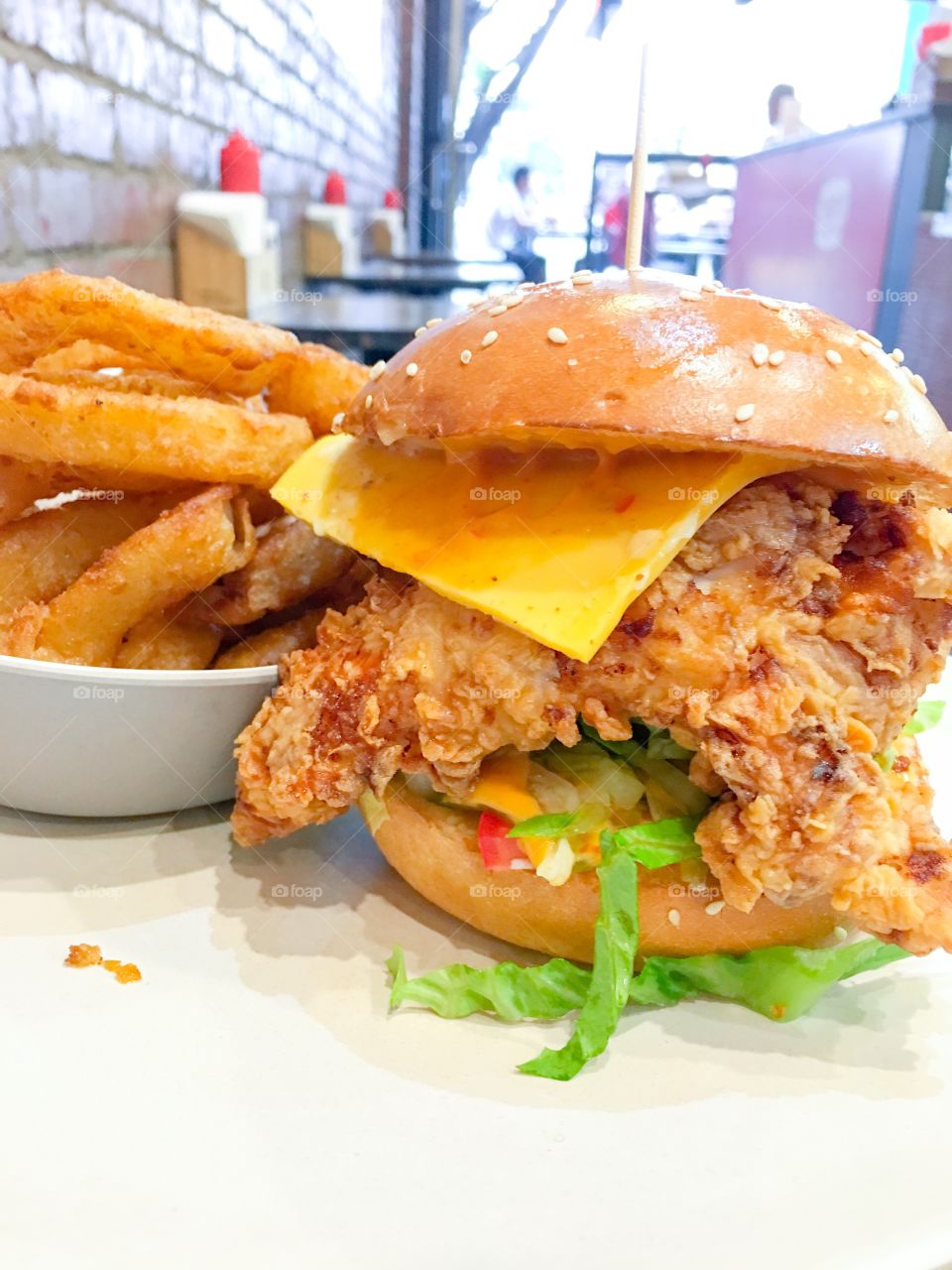 Southern fried chicken burger and onion rings